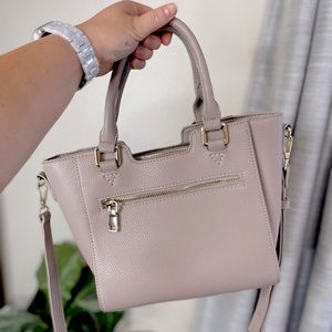 Cross body, lavender handbag with gold hardware.